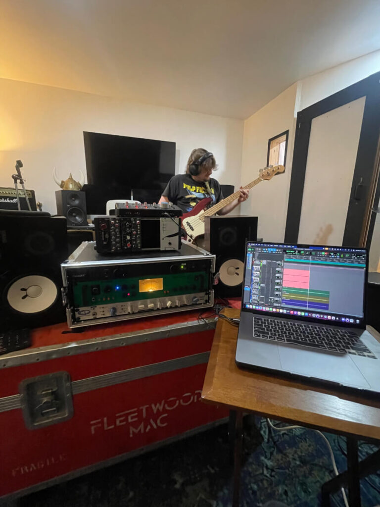 Guy Recording Bass with Compressor